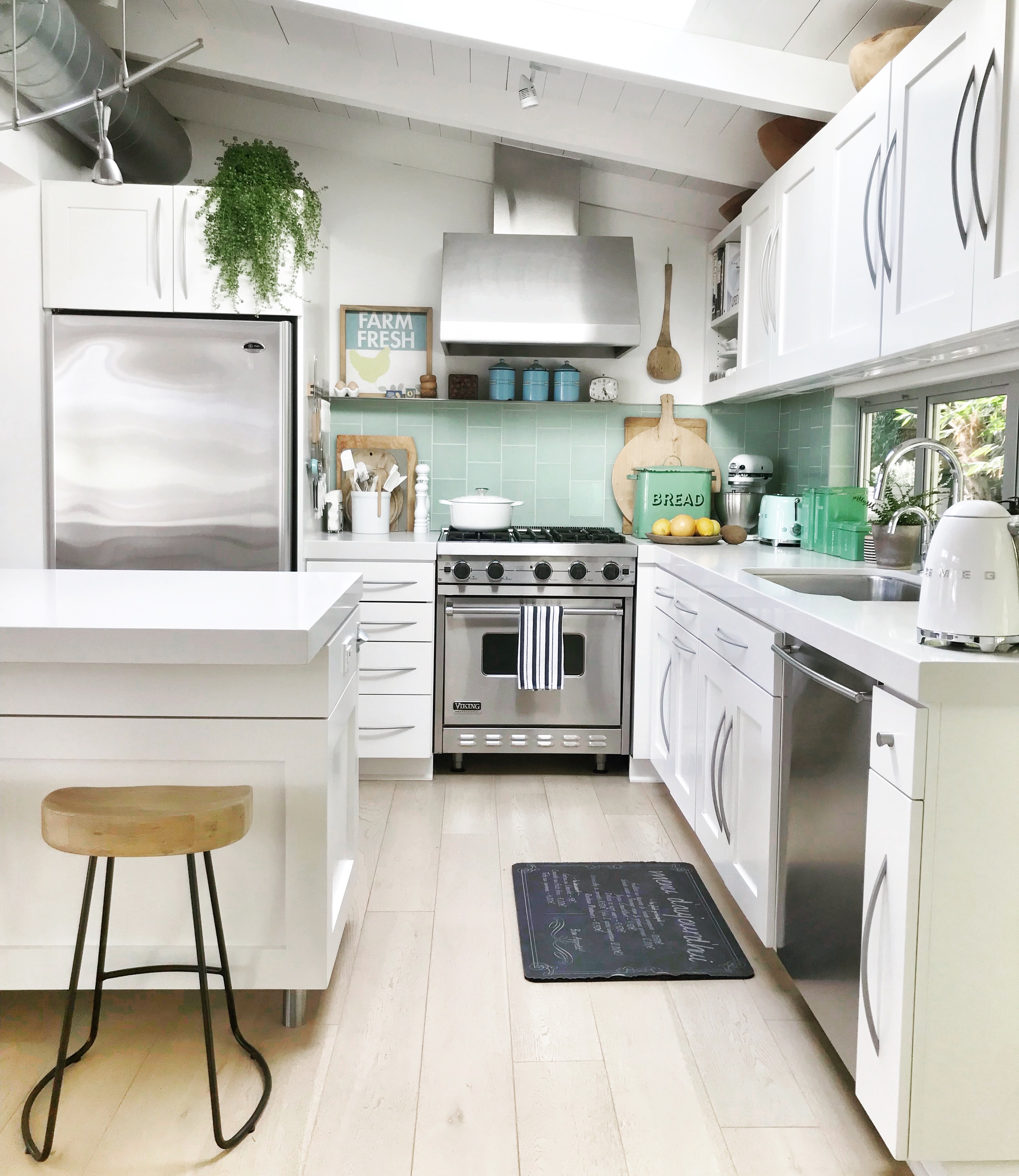 Little Glass House Kitchen with white cabinets